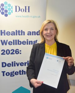 Picture of Cathy Harrison with report 
